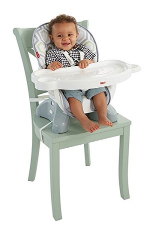 Fisher-Price SpaceSaver high chair with a kid.